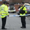 Cảnh sát phong tỏa lối vào một tuyến phố ở Moss Side thuộc Manchester. (Nguồn: AFP/TTXVN)