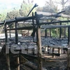 Ngôi nhà Lang tại Bảo tàng không gian văn hóa Mường bị đốt chỉ còn trơ khung gỗ. (Nguồn: Vietnam+)