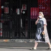 Người dân đeo khẩu trang phòng lây nhiễm COVID-19 tại Melbourne, Victoria, Australia (Ảnh: THX/TTXVN)
