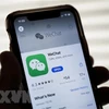 Biểu tượng WeChat trên một màn hình điện thoại (Ảnh: AFP/TTXVN)