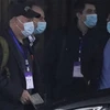 Chuyên gia WHO rời khách sạn đi thực địa điều tra về Covid-19 tại Vũ Hán, Trung Quốc, ngày 1/2 (Ảnh: AP.)