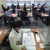 Sinh viên tại một trường đại học Hàn Quốc đeo khẩu trang khi đến lớp. (Nguồn: CNN) 