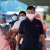 Người dân đeo khẩu trang nhằm ngăn chặn sự lây lan của dịch COVID-19 tại Jakarta, Indonesia. (Ảnh: THX/TTXVN)