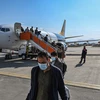 Hành khách tại sân bay Kabul, Afghanistan, ngày 24/11/2021. (Ảnh: AFP/ TTXVN)