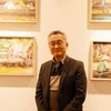 Tác giả Kim Jai-min tại triển lãm. (Ảnh: Anh Nguyên/TTXVN)