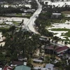 Mưa lớn và bùn đất đang cản trở công tác tìm kiếm những người sống sót sau trận lở đất tại các ngôi làng miền Trung Philippines. (Nguồn: AP)