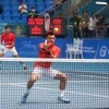 Pha đánh của tay vợt Lê Quốc Khánh (Việt Nam) tại trận đấu vòng 1 nội dung đôi nam. (Ảnh: Thế Duyệt/TTXVN)