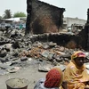 Người dân khu vực Đông Bắc Nigeria phải sống trong cảnh nghèo khó, thiếu ăn do làn sóng bạo lực do phiến quân Boko Haram gây ra. (Ảnh: AFP/TTXVN) 