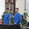Hai bị cáo Chu Viết Tuấn và Bùi Quý Dương tại phiên tòa xét xử. (Ảnh: Vũ Hà/TTXVN)