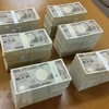 Đồng tiền giấy mệnh giá 10.000 yen Nhật Bản. (Ảnh: AFP/TTXVN) 