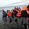 Người di cư vượt biển vào châu Âu. (Nguồn: AFP/TTXVN)