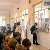 Người dân chờ cấp thuốc tại phòng cấp thuốc BHYT của Bệnh viện Đa khoa Lâm Đồng.(Nguồn: Báo Lâm Đồng)