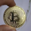 Đồng tiền kỹ thuật số Bitcoin. (Ảnh: AFP/TTXVN) 