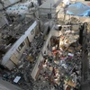 Các tòa nhà bị phá hủy sau cuộc không kích của Israel tại Dải Gaza ngày 14/12/2023. (Ảnh: THX/TTXVN)