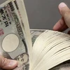 Đồng tiền mệnh giá 10.000 yen của Nhật Bản. (Ảnh: AFP/ TTXVN) 