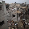 Các tòa nhà bị phá hủy sau cuộc không kích của Israel tại Dải Gaza ngày 25/12/2023. (Ảnh: THX/TTXVN)