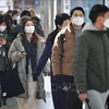 Người dân đeo khẩu trang phòng dịch COVID-19 tại Seoul, Hàn Quốc. (Ảnh tư liệu: AFP/TTXVN)