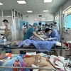 Các bệnh nhân đang cấp cứu tại Bệnh viện đa khoa Thống Nhất. (Ảnh: Sỹ Tuyên/TTXVN)