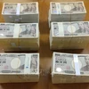 Đồng tiền mệnh giá 10.000 yen tại thành phố Yokosuka, quận Kanagawa (Nhật Bản). (Ảnh: AFP/TTXVN)
