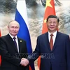 Chủ tịch Trung Quốc Tập Cận Bình (phải) và Tổng thống Nga Vladimir Putin tại cuộc gặp ở Bắc Kinh ngày 16/5/2024. (Ảnh: AFP/TTXVN) 
