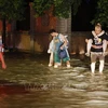 Cảnh ngập lụt sau những trận mưa lớn tại Trung Quốc. (Ảnh: AFP/TTXVN)