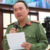 Đại tá Trương Minh Đương - giám đốc Công an tỉnh Lâm Đồng - trả lời chất vấn liên quan đến đấu tranh với tín dụng đen trên địa bàn tỉnh.( Nguồn: Báo Tuổi trẻ) 