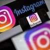 Biểu tượng Instagram trên màn hình điện thoại di động. (Ảnh: AFP/TTXVN)