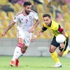 Ali Ahmed Mabkhout (mang áo số 7) chơi rất nổi bật trong đội hình UAE. (Ảnh: Hoàng Linh/TTXVN)