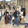 Người dân Afghanistan, những người làm việc cho các dự án của Hàn Quốc, được sơ tán tới thủ đô Seoul ngày 26/8/2021. (Ảnh: Yonhap/TTXVN)