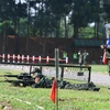 Các xạ thủ Quân đội nhân dân Việt Nam thực hiện bài thi tại vị trí bắn. (Ảnh: TTXVN)