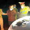 Đối tượng Phan Lê Huy bị phát hiện và bắt giữ khi vận chuyển, tàng trữ trái phép ma túy và vũ khí trên xe. (Ảnh: TTXVN)