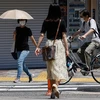 Người dân đeo khẩu trang phòng dịch COVID-19 tại Tokyo (Nhật Bản), ngày 19/7/2021. (Ảnh: AFP/TTXVN)