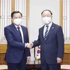 Phó Thủ tướng Lê Minh Khái và Phó Thủ tướng Hàn Quốc Hong Nam-ki. (Ảnh: Doãn Tấn/TTXVN)