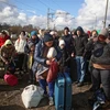 Người tị nạn rời khỏi Lviv (Ukraine) tới Olkusz (Ba Lan) ngày 28/2/2022. (Ảnh: PAP/TTXVN)