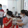 Tiêm vaccine cho học sinh tại Trường Tiểu học, Trung học cơ sở và Trung học Victory, thành phố Buôn Ma Thuột). (Ảnh: Tuấn Anh/TTXVN)