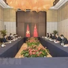 Bộ trưởng Ngoại giao Bùi Thanh Sơn hội đàm với Ủy viên Quốc vụ, Bộ trưởng Ngoại giao Trung Quốc Vương Nghị tại thành phố Hồ Châu, tỉnh Chiết Giang (Trung Quốc), hồi tháng 12/2021. (Ảnh: TTXVN phát)