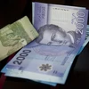 Đồng tiền peso Chile tại Santiago. (Ảnh: AFP/TTXVN)