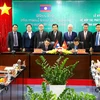 Đại diện tỉnh Bình Dương và tỉnh Champasak (Lào) ký kết hợp tác trên nhiều lĩnh vực trong giai đoạn 2022-2026. (Ảnh: TTXVN phát)
