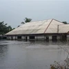 Nhiều ngôi nhà bị ngập trong nước lũ tại Ahoada, Nigeria, ngày 21/10/2022. Ảnh: AFP/TTXVN