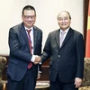 Chủ tịch nước Nguyễn Xuân Phúc tiếp Chủ tịch kiêm Tổng Giám đốc Tập đoàn SCG Roongrote Rangsiyopash. (Ảnh: Thống Nhất/TTXVN)