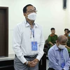 Bị cáo Cao Minh Quang (sinh năm 1956, cựu Thứ trưởng Bộ Y tế) khai báo trước toà. (Ảnh: Phạm Kiên/TTXVN)