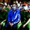 Bị cáo Nguyễn Minh Khải tại phiên xét xử ngày 30/11/2022. (Ảnh: Thành Chung/TTXVN)