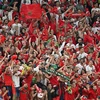 Cổ động viên Maroc vỡ òa khi đội nhà xuất sắc giành tấm vé vào bán kết. (Ảnh: AFP/TTXVN)