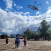 Nhân viên cứu hộ làm nhiệm vụ tại các khu vực ngập lụt ở Cowra (Australia), ngày 14/11/2022. (Ảnh: AFP/TTXVN)