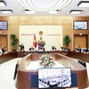 Các đại biểu biểu quyết tại phiên họp của Ủy ban Thường vụ Quốc hội chiều 30/12/2022. (Ảnh: Doãn Tấn/TTXVN)