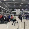Hành khách làm thủ tục tại sân bay sân bay quốc tế Suvarnabhumi (Thái Lan). (Ảnh: Huy Tiến/TTXVN)