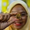 Vàng miếng được bán tại Kota Bharu, bang Kelantan (Malaysia). (Ảnh: AFP/TTXVN)