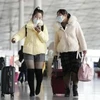 Hành khách tại sân bay ở Bắc Kinh (Trung Quốc). (Ảnh: Kyodo/TTXVN)