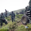 Các tay súng M23 gác tại Bunagana (CHDC Congo). (Ảnh: AFP/TTXVN)
