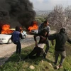 Chuyển người Palestine bị thương trong xung đột với binh sỹ Israel tại thành phố Nablus, khu Bờ Tây ngày 25/2/2023. (Ảnh: THX/TTXVN)